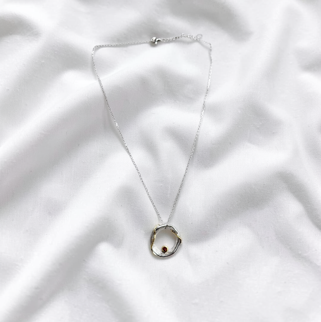 Golden Orbit Garnet Pendant Necklace
